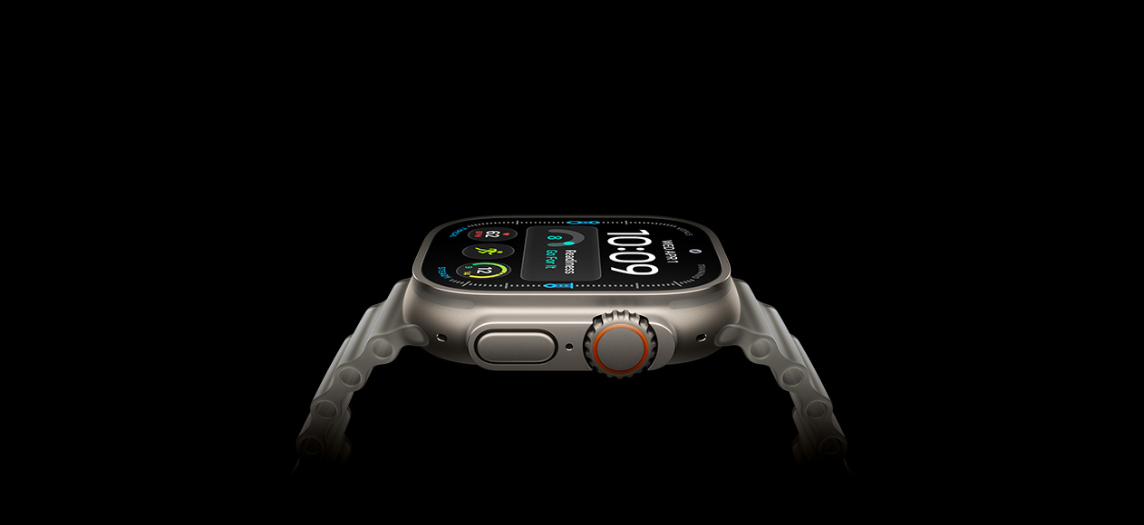 Apple Watch Ultra 4, titanium case, natural colour, right exterior, Digital Crown, raised side button, digital watch face, translucent grey Ocean Band