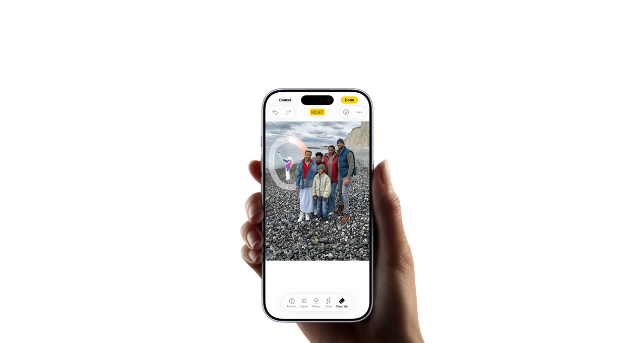 A hand holds an iPhone 17, demonstrating the Apple Intelligence Live Translation feature