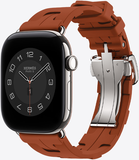 Apple Watch Hermès Series 12, Circulaire analog watch face, (hour, minute and second hands, complications: Weather, Noise, Activity rings, and Paris time), titanium case, silver color, right side exterior, Digital Crown, side button, paired with Kilim Single Tour band, cuivre color (brown), molded rubber material, geometric interlocking design, silver-colored metal clasp
