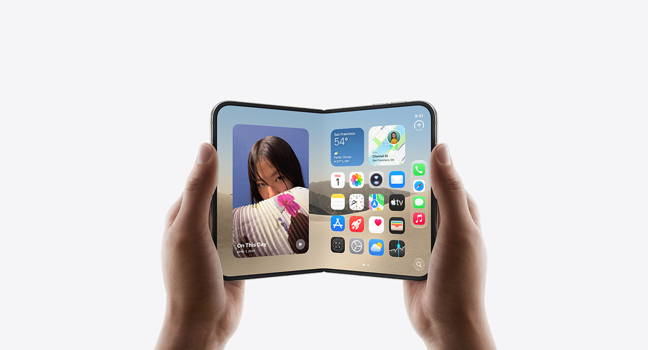 iPhone Duo, held by two hands in open landscape position, inside exterior, Star White color, iOS home screen display, photos on the left, apps on the right