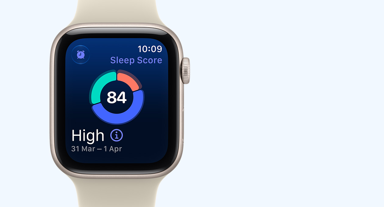 Apple Watch SE 3, aluminium case, starlight colour, screen shows sleep score circle graph, right side exterior, Digital Crown dial, Sport Band, sand colour (pale tan)