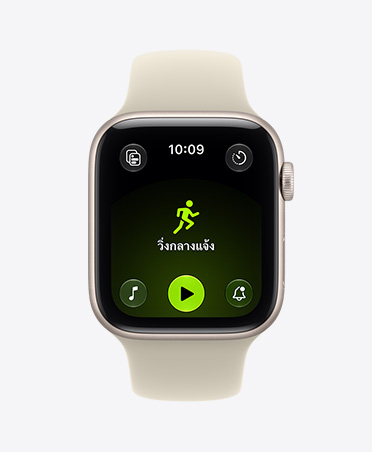 Apple Watch SE 3, aluminum case, starlight color, screen shows Workout app (outdoor run), right side exterior, Digital Crown dial, Sport Band, sand color (light tan)