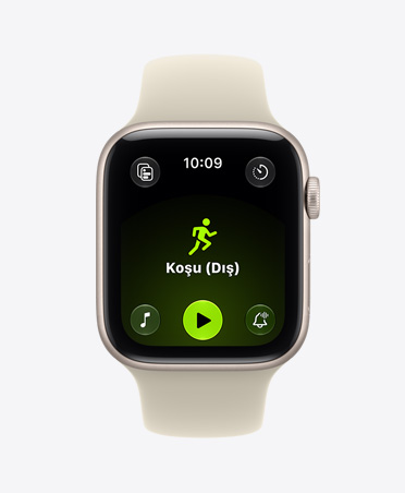 Apple Watch SE 3, alüminyum kasa, yıldız ışığı renk, ekranda Antrenman uygulaması (koşu (dış)) gösteriliyor, sağ dış görünüm, Digital Crown, Spor Kordon, kum beji (hafif uçuk kahve) renk