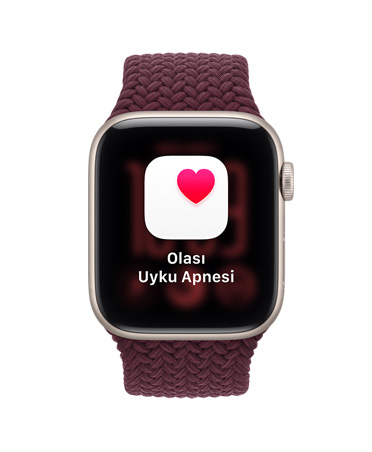 Apple Watch SE 3, ekranda olası uyku apnesi bildirimi gösteriliyor, alüminyum kasa, yıldız ışığı renk, sağ dış görünüm, Digital Crown, Örgü Spor Loop kordon takılı, burgonya renk