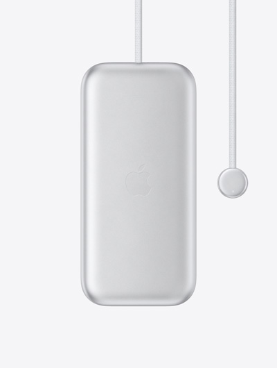 Batterie pour Apple Vision Pro, extérieur, logo Apple au centre, câble d’alimentation intégré avec connecteur rond à l’une des extrémités, voyant LED sur le connecteur