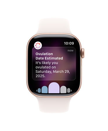 Apple Watch Series 11, casing aluminium, warna emas rose, pemberitahuan perkiraan tanggal ovulasi, eksterior sisi kanan: Digital Crown, Tali Jam Sport pink lembut