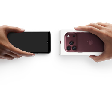 Two hands side by side, hand holding Android without box, trade-in, with hand holding new iPhone 18 Pro box